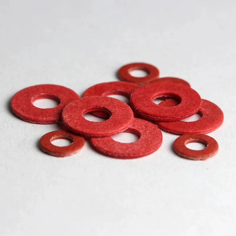 Red vulcanized fiber electrical insulating washers in assorted sizes